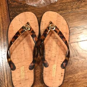 NEVER WORN Michael Kors flip flops.